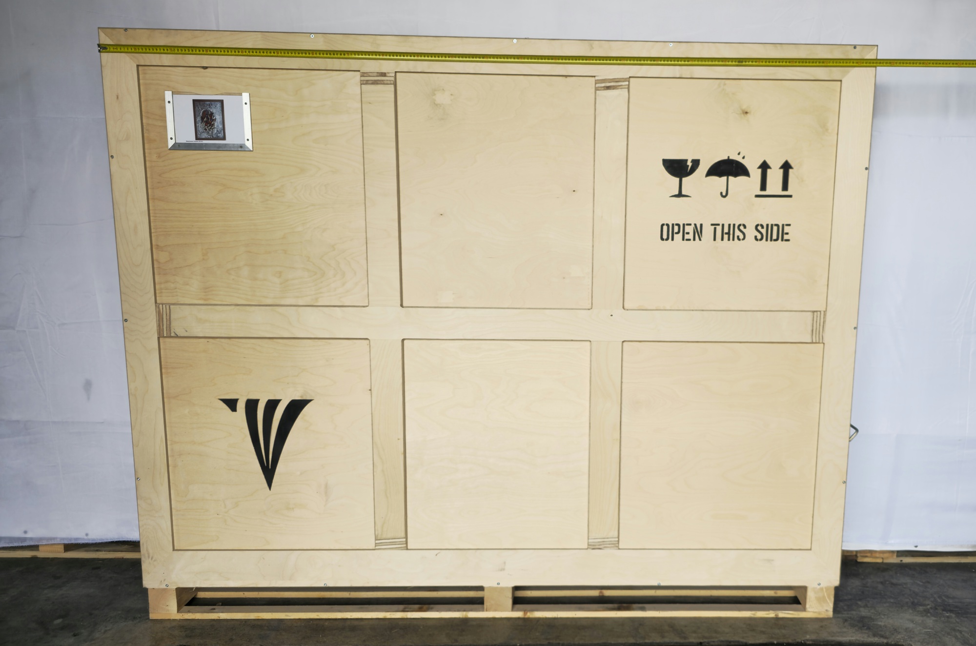 Crate width reference for Babylonian Human, 2008 with tape measure