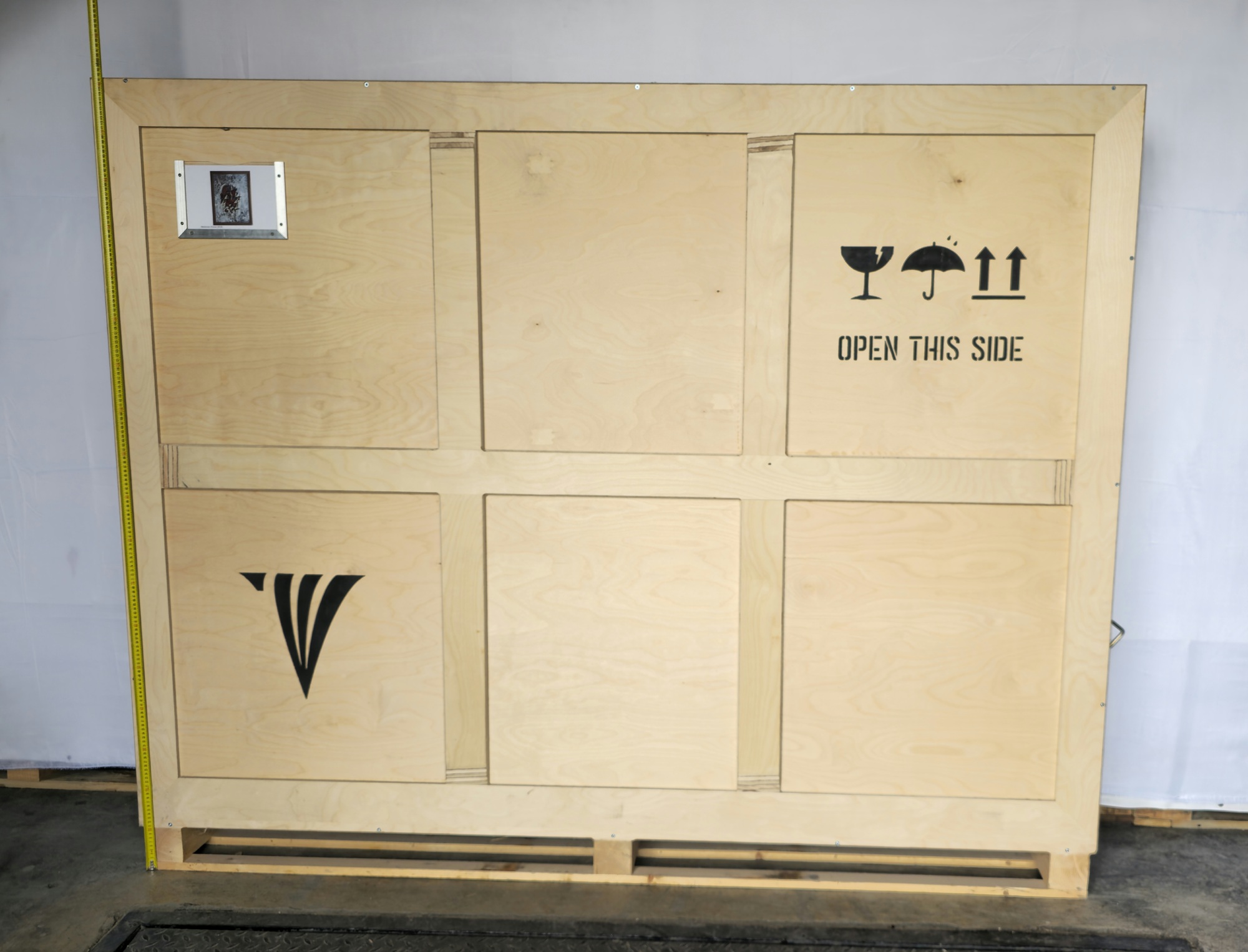 Crate height reference for Babylonian Human, 2008 with tape measure