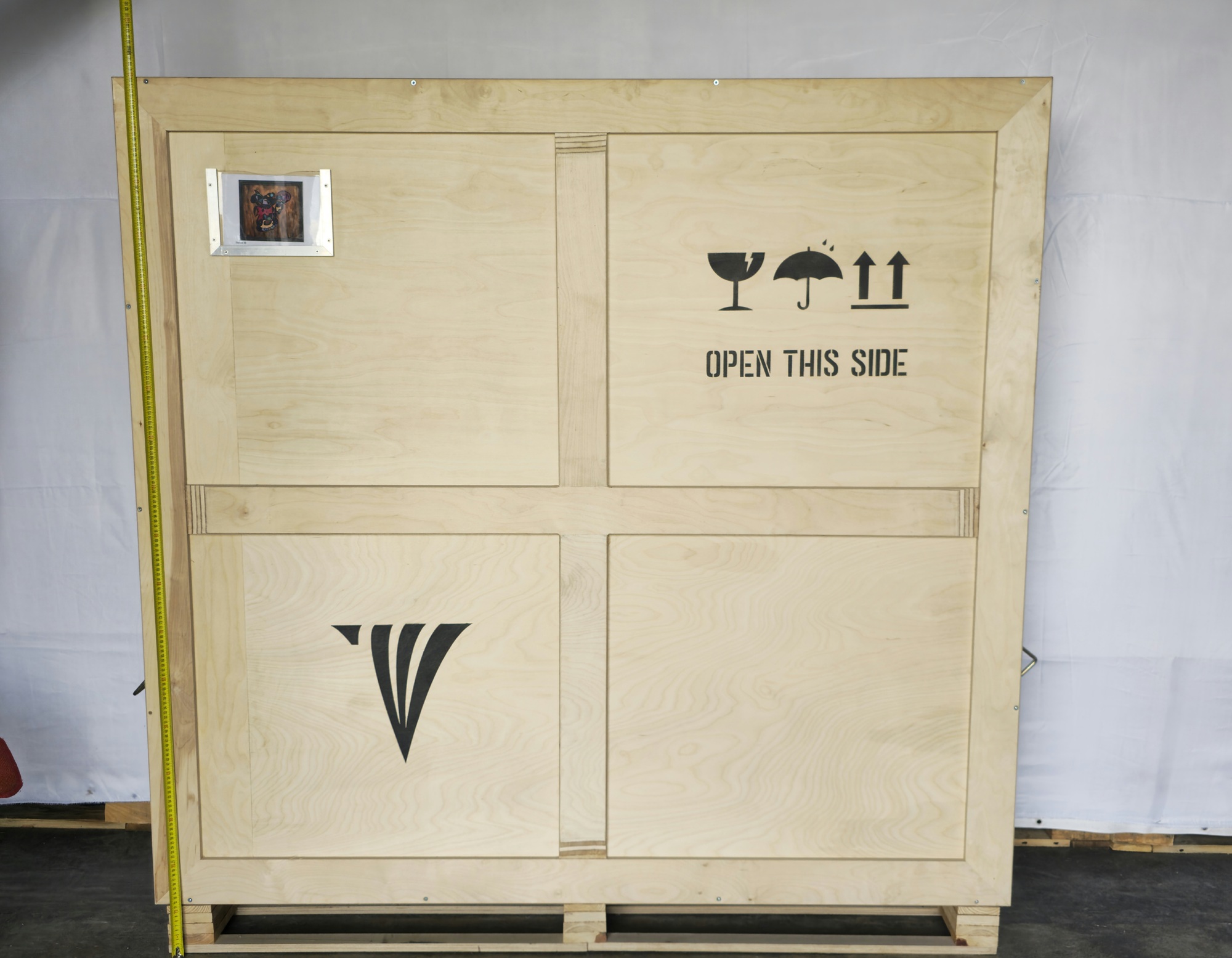Crate height reference for Darius III , 2005 with tape measure