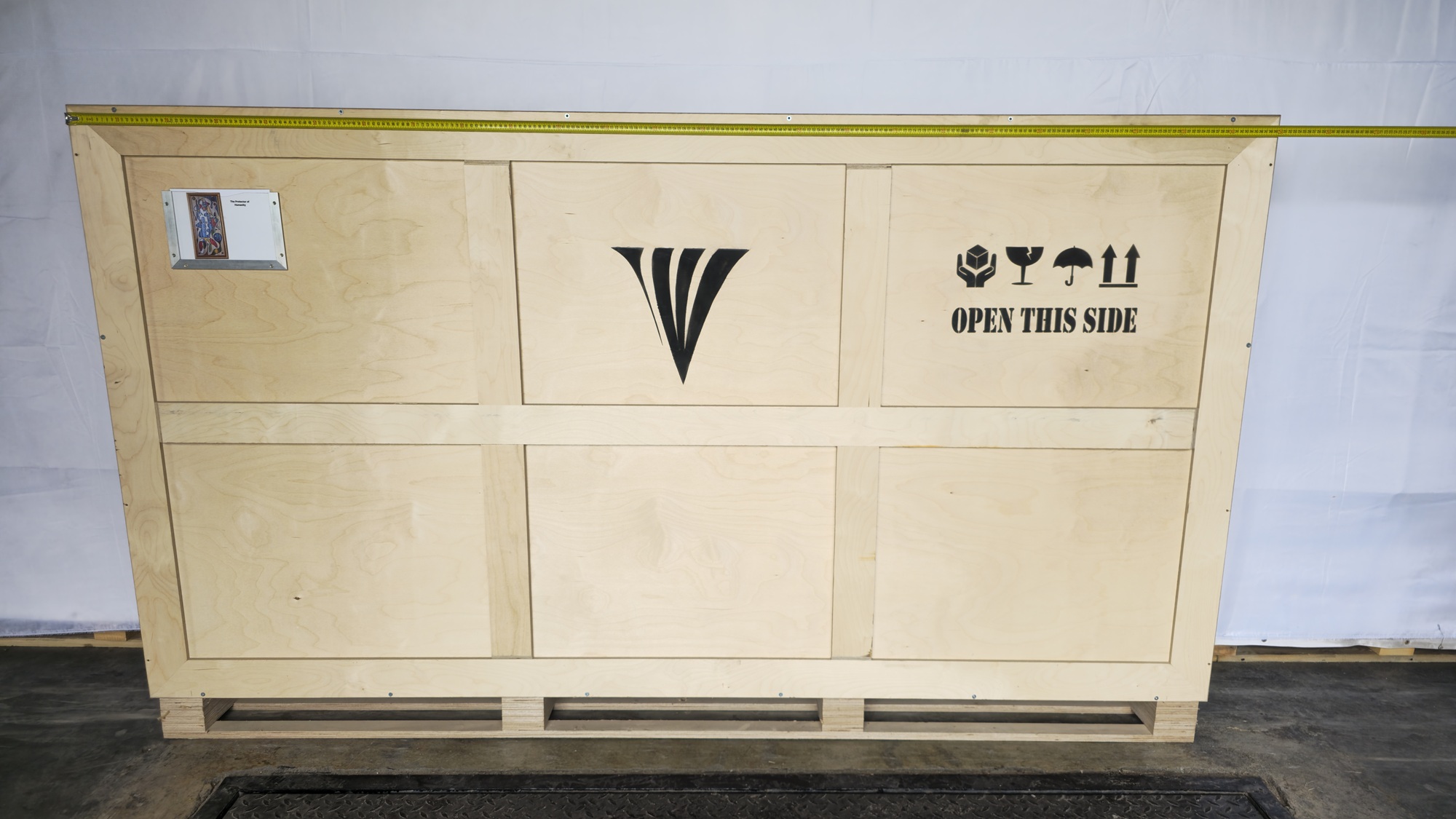 Crate width reference for The Protector of Humanity, 2017 with tape measure