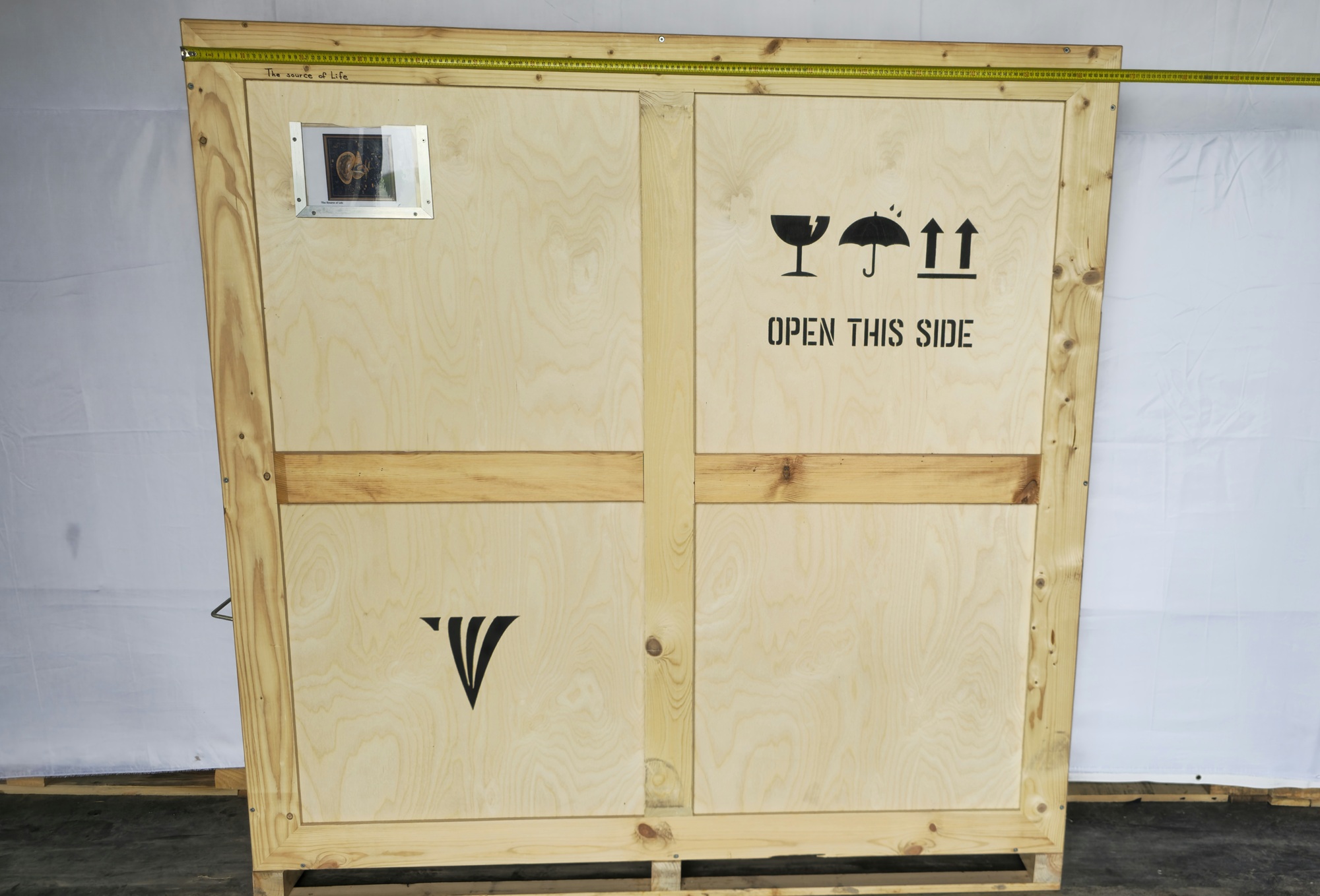Crate width reference for The source of life, 2007 with tape measure